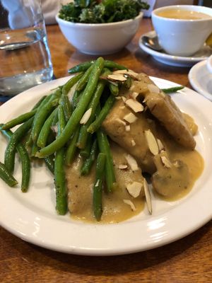 Tempeh with gravy, mashed red potatoes underneath and topped with green beans and almonds.  at Detroit Vegan Soul - East in Detroit