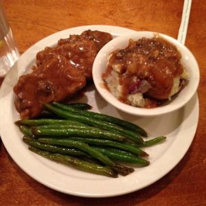 smothered tempeh with mashed Redskins potatoes and green beans  at Detroit Vegan Soul - East in Detroit