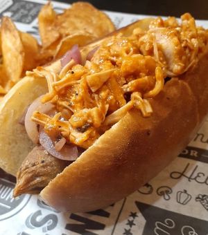 Vegan Buffalo Blu Dog -Buffalo Jackfruit, caramelized onion, and vegan Blue Cheese. at Sporty Dog Creations in Baltimore