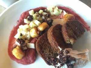 Gluten-free vegan banana french toast with rhubarb compote, fruit salad & coconut cream on the side.  at The Acorn in Vancouver