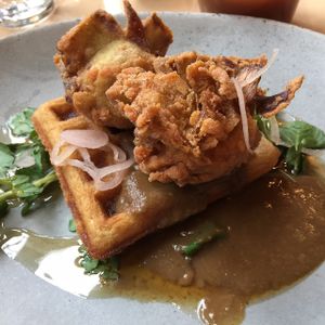 Southern Fried Artichokes, House Waffle, Pickled Shallots, Bourbon Maple Syrup and Mushroom Red-Eye Gravy. at The Acorn in Vancouver