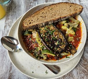 Vegan Shakshuka with vegetables, half an eggplant, sourdough bread (13.90€) at Buur Deli in Dusseldorf