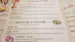 The orange dots indicate vegan dishes. The green, the vegetarian ones. at Il Melograno in Tavagnacco