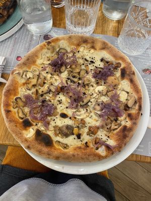 Autumn veggie pizza (mushrooms, caramelized onions, olive powder)  at Il Melograno in Tavagnacco