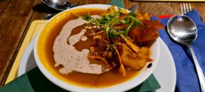 Butternut squash soup with hazelnut cream and root vegetable crisps at The Fromeway in Radstock