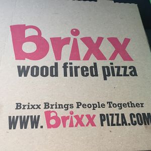 pizza box cover at Brixx Wood Fired Pizza - Birkdale in Charlotte