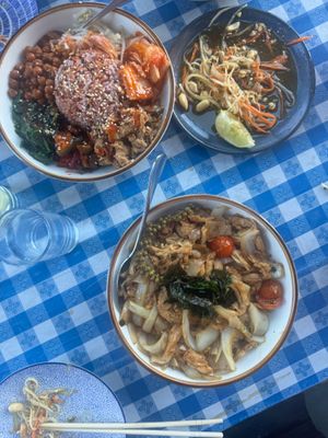 Clockwise from upper left: cauliflower curry, papaya salad, drunken fettuccine  at Norah - Belmont in Portland