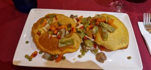 Tortos con "pisto" (menestra) at Agora  in Llanes