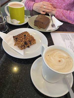 Oat milk hot chocolate, sticky ginger cake, oat latte and fruit flapjack   at Greens Cafe in Grasmere