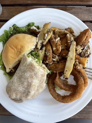 (All portions split in half): Preposterous burger, chickun caesar wrap, onion rings, and chickun bacun ranch poutine  at Odd Burger in Calgary