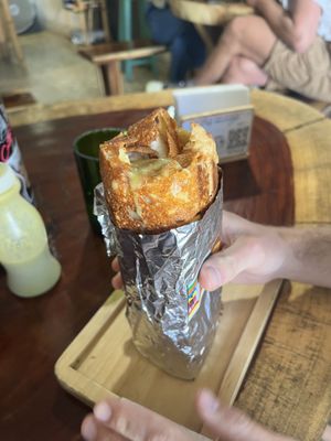 Burrito covered with cheese   at Donki Burritos Sancris in San Cristobal De Las Casas