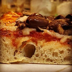 The Marks Vegan mushroom olive pizza using vegan nut based cheese.
 at The Mark Restaurant in Olympia