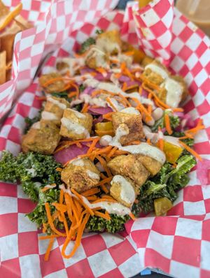 Delicious kale salad vegan as is. You can add marinated tofu for extra protein. Super delicious and filling! at The Grey Eagle Taqueria in Asheville