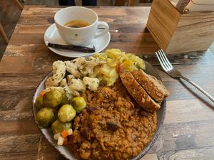 Vegan Chilli with bread and salads. The salads are potato salad, cauliflower and Brussels sprouts. Also a double espresso.  at Ivi's Veggie & Coffee Dreams in Bamberg