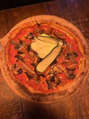 Pimped “the hero” pizza with additional “La Vie” vegan bacon    at BrewDog - Marais in Paris