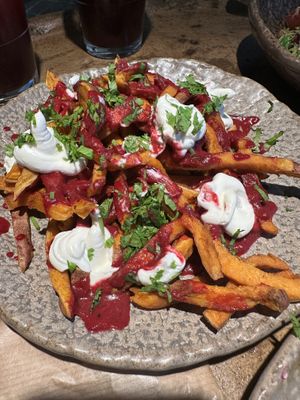 Sweet potato fries with beetroot ketchup and vegan sour cream   at Honest Greens - Caleido in Madrid