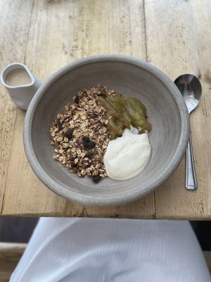 Granola with vegan yoghurt and fresh rhubarb (+ oat milk)   at Remedy Coffee Shop in York