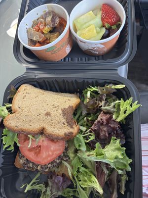 Black Bean & Quinoa Burger on a Gluten Free Bun with Green Salad. Sides of Roasted Veggies and Fruit. Did not disappoint. Excellent food    at Frothy Monkey in Birmingham