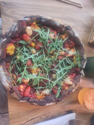 Pizza with activated charcoal. at Vita Rama in Sofia