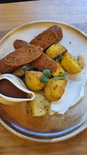 Roasted potatoes, gravy and chickpea sausages at Vita Rama in Sofia