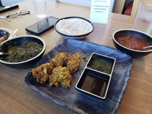 Tofu saag, pakoras and mushroom vindaloo, half eaten as we couldn't wait! at Great Taste Indian and More in Highlands Ranch