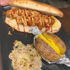 Doggo - vegan hot with Future farm sausage, ketchup, mayo, onions. Jacked potato and sauerkrauts   at La Forgia degli Eroi in Milan