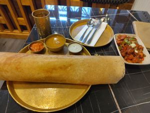 Masala dosa, chilli gobi and a glass of water. Perfect! at Puraan in North London