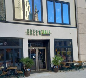 Rathaus reflected in window at Greentable in Hamburg