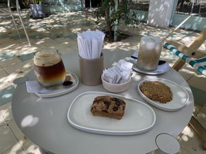 Espresso Tonic, banana choco brownie, oat cookie and ice cafe classic with almond milk  at Paloma Bakery House in Mendoza