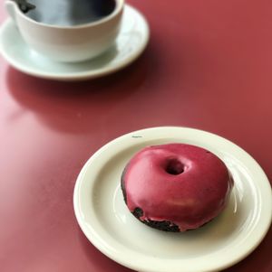 Raspberry Donut + Coffee. Breakfast of Champs! at Beet Box Bakery & Cafe in Denver