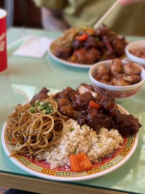Deluxe plate with half fried rice, half noodles, sweet & sour pork, kung pao chicken and lemon chicken.  at Oscar in Tokyo