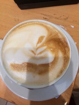 Delicious latte at Cosmos-Heart Cafe in Augsburg