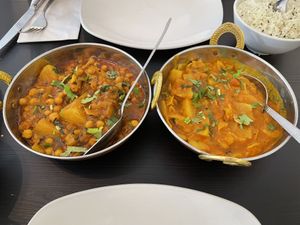 Vegetable dahnsak and Chickpea potato curries   at Taste of India in Isle Of Skye