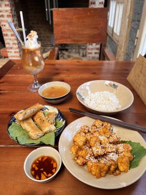 Garlic “butter” tofu, friend spring rolls, coconut coffee  at Thong Dong 2 - Vegan Friendly Kitchen in Lao Cai