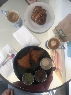 Croissant from Little Loaf Bakeshop & samosas from Samosa Shack   at Blackbird Infoshop & Cafe in Kingston