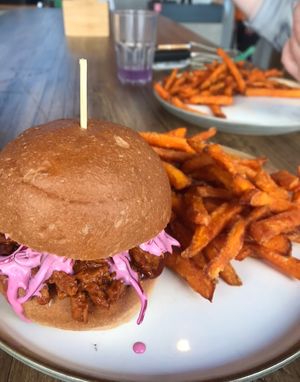 “Save the pig” burger with sweet potato fries   at Pray For Burger in Milan