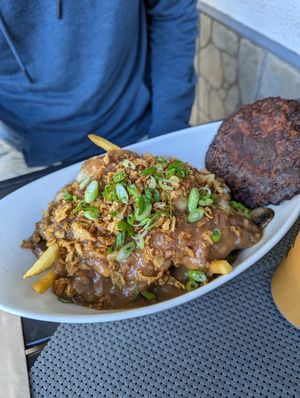 Vegan poutine, added grilled mushrooms in garlic, and a quinoa burger addition. at Q Burger in Qualicum Beach