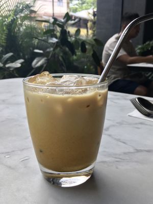 Golden mylk (soy milk, turmeric, ginger, black pepper, vanilla, coconut sugar)  at Ver De in El Nido