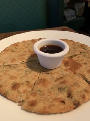 Scallion pancake. Very good  Nice and chewy. Not too overpowering with the scallions. Could have used a more interesting sauce, but I just ate it with my meal.  at Green Sprout in Atlanta