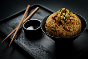 Yakimeshi Mixto:
Veggie fried rice with scrambled tofu, white seitan & red seitan. 100% plant-based and packed with flavor—you won’t believe it’s all vegan! at Ishiki - Cloud Kitchen in Mexico City