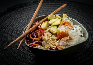 Translucent harusame noodles with a vibrant mix of Brussels sprouts, carrots, purple cabbage, and roasted peanuts, all coated in our spicy sriracha-peanut dressing.  at Ishiki - Cloud Kitchen in Mexico City