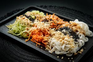 Thick rice noodles with Persian cucumber, carrot, cashews & peanuts in a spicy tahini dressing. Served cold, aromatic & with a subtle bitter kick. at Ishiki - Cloud Kitchen in Mexico City