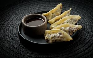 Dumplings Colorful:
Steamed dumplings filled with Brussels sprouts, purple cabbage, caramelized onion & shiitake. Sweet, smoky, and seriously addictive. at Ishiki - Cloud Kitchen in Mexico City