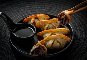 Gyozas Colorful:
Crispy pan-fried gyozas filled with Brussels sprouts, purple cabbage, caramelized onion & shiitake. Sweet, smoky & full of flavor. at Ishiki - Cloud Kitchen in Mexico City