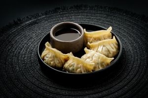 Dumplings de Tofu:
Soft tofu marinated with a hint of ginger, mixed with finely chopped peanuts & cashews. Steamed to perfection. Served with premium ponzu. at Ishiki - Cloud Kitchen in Mexico City