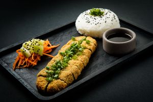 Fishtán:
Crispy panko-breaded seitan with a subtle sea-inspired flavor. Served with dipping sauce, rice & pickled veggies. Addictive and 100% plant-based. at Ishiki - Cloud Kitchen in Mexico City