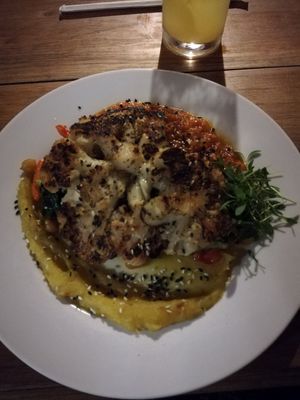 Baked coliflor on different salsas, chickpeas and veggies at Maxan in Antigua