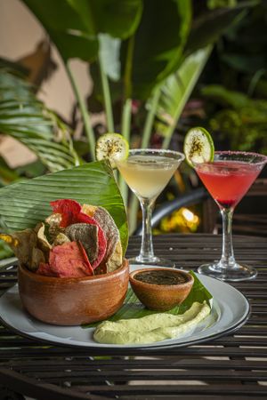 Tostadas de maíz de colores con mousse de aguacate y salsa negra oaxaqueña at Maxan in Antigua