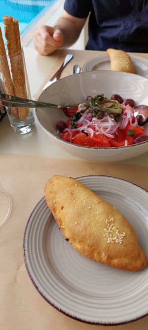 Tomato salad and spinach pita at GOJI Vegan Hotel in Rhodes