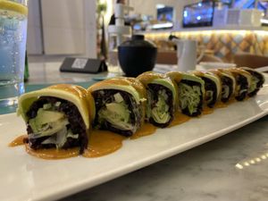 Riceberry Roll : Black rice, Avocado, Nut Sauce    at Sushi Library in Riyadh
